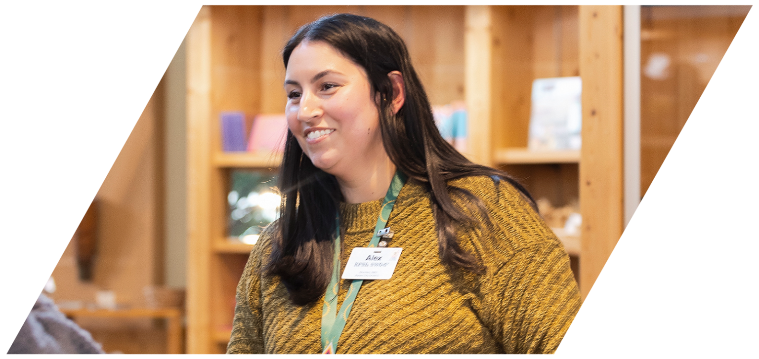 woman smiling while talking to other person